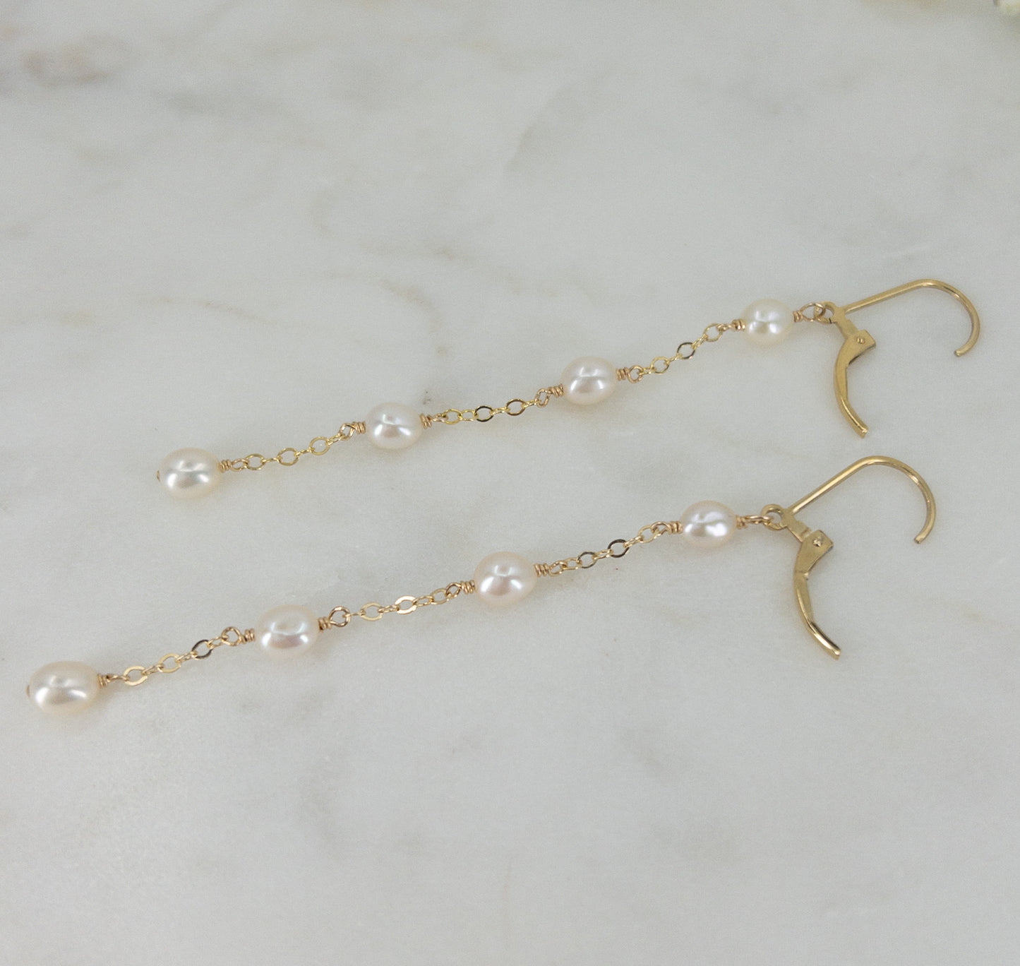 photo of leverback earrings open with long pearl dangles
