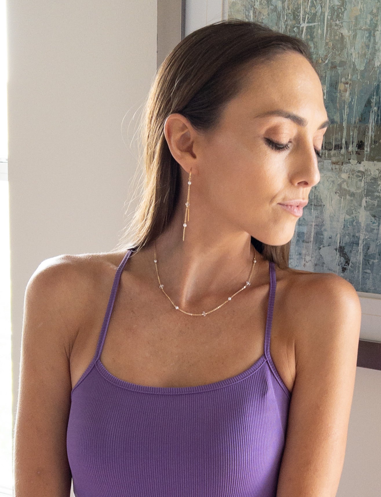 model wearing pearl necklace and earrings set