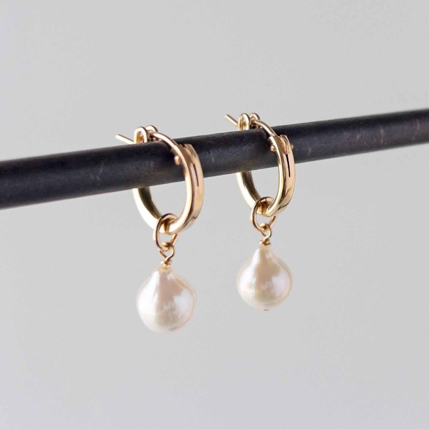 pearl hoop earrings on stand