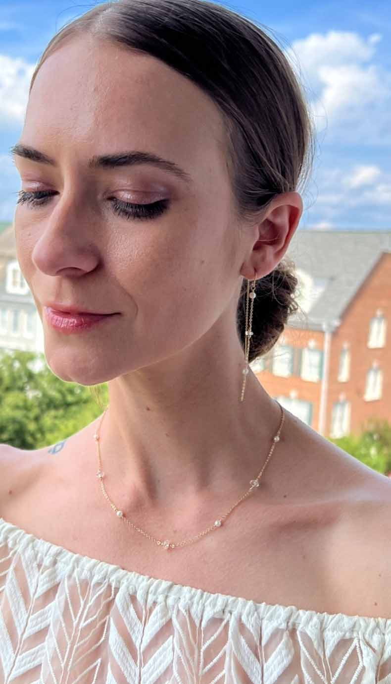 model wearing herkimer diamond necklace with tiny pearls and matching earrings
