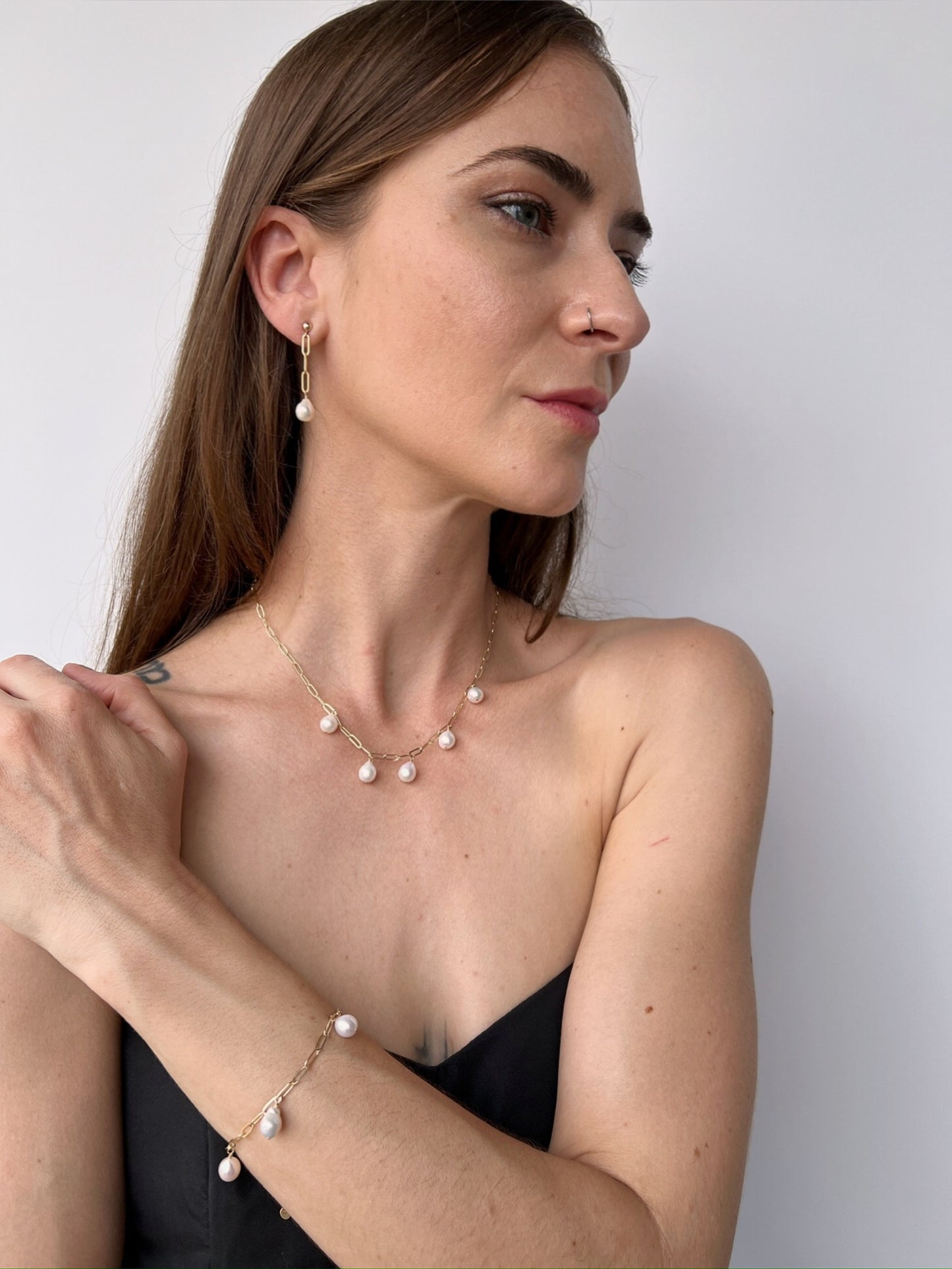 model wearing matching necklace, bracelet and earrings from the Vivara Collection