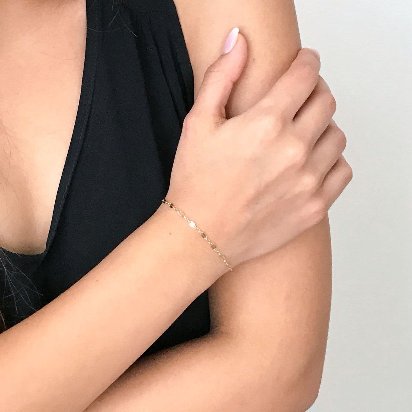 model wearing Isabella Chain Bracelet in gold