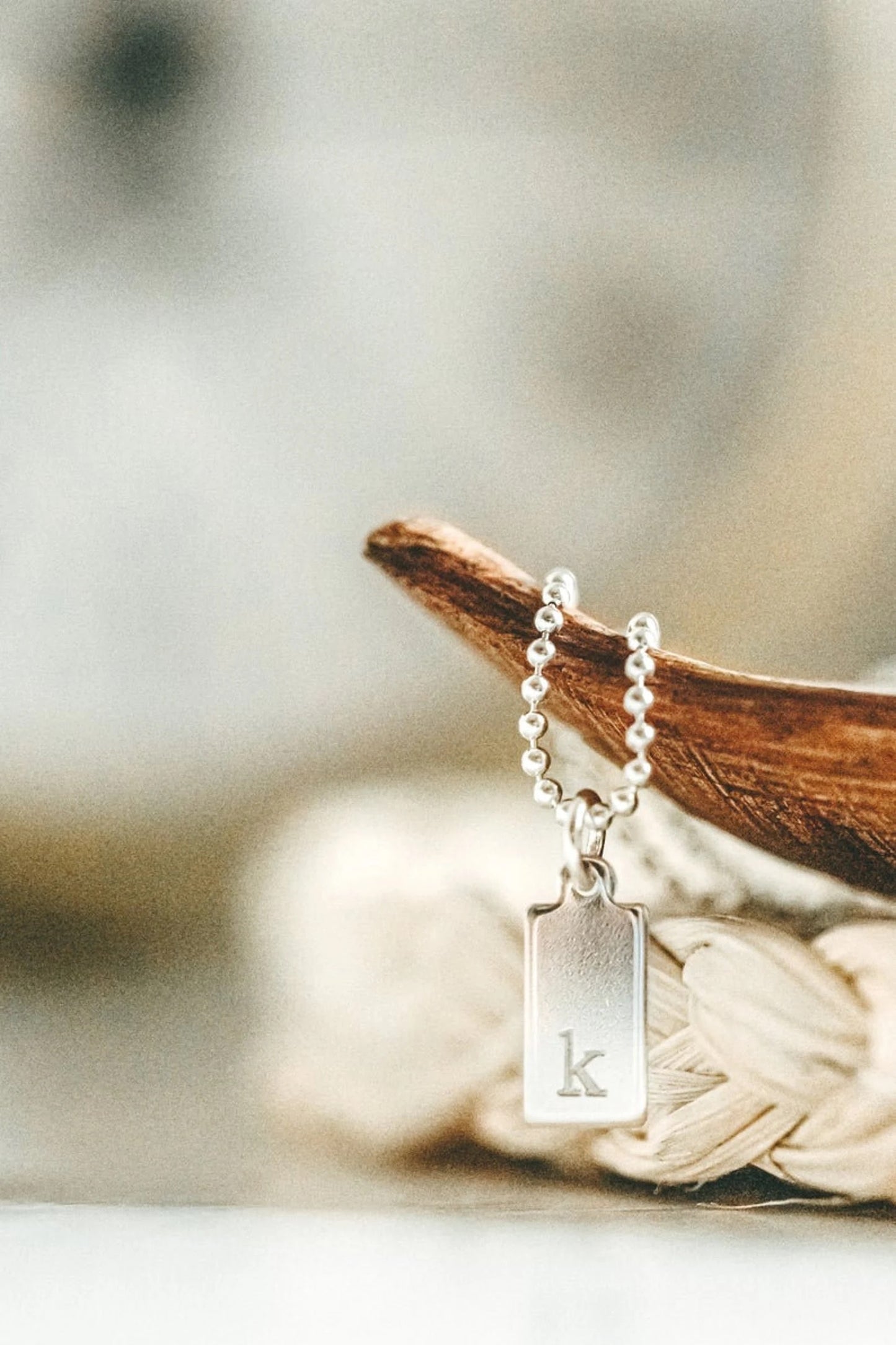 close up of engraved tag with letter K