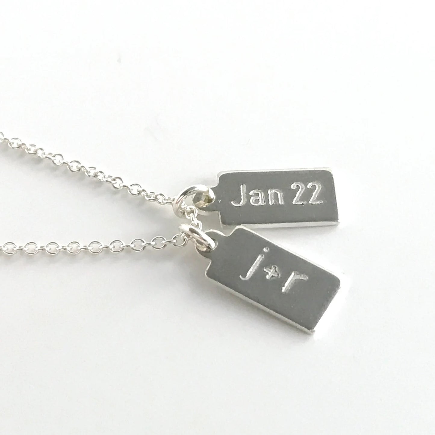 close up of engraved small dog tags