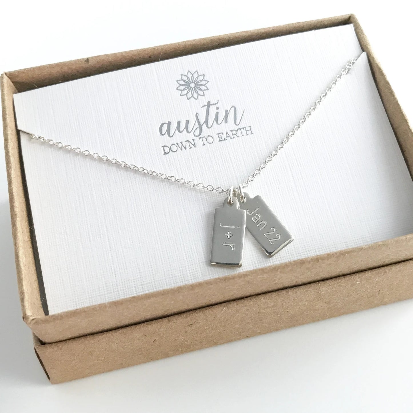dog tag necklace in sterling silver with two engraved charms