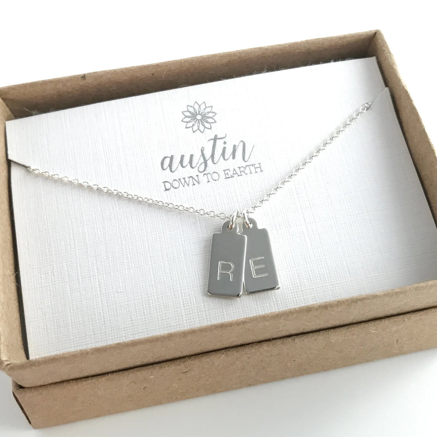 sterling silver necklace with two engraved charms with single initials
