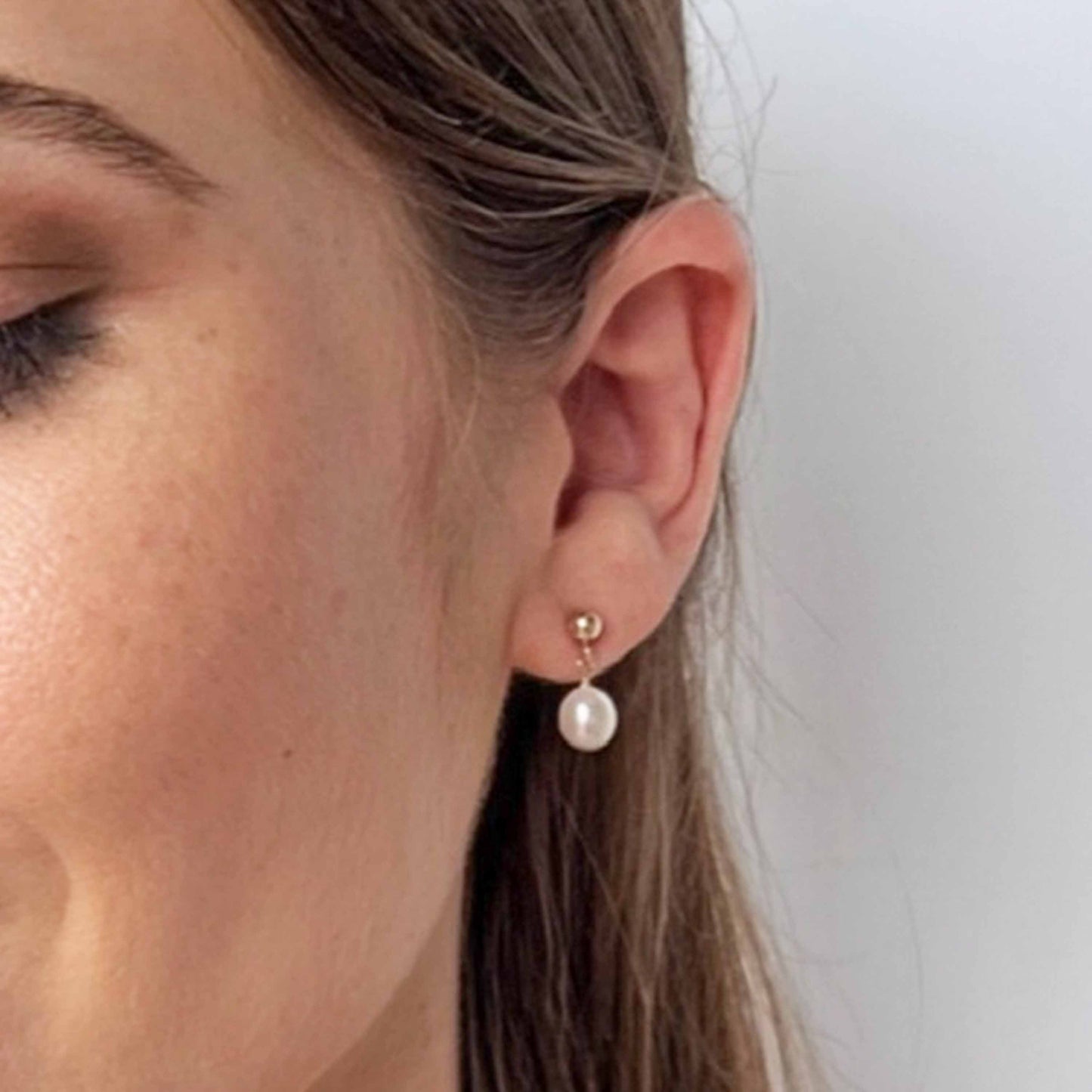 model close up of Nicole pearl drop earrings