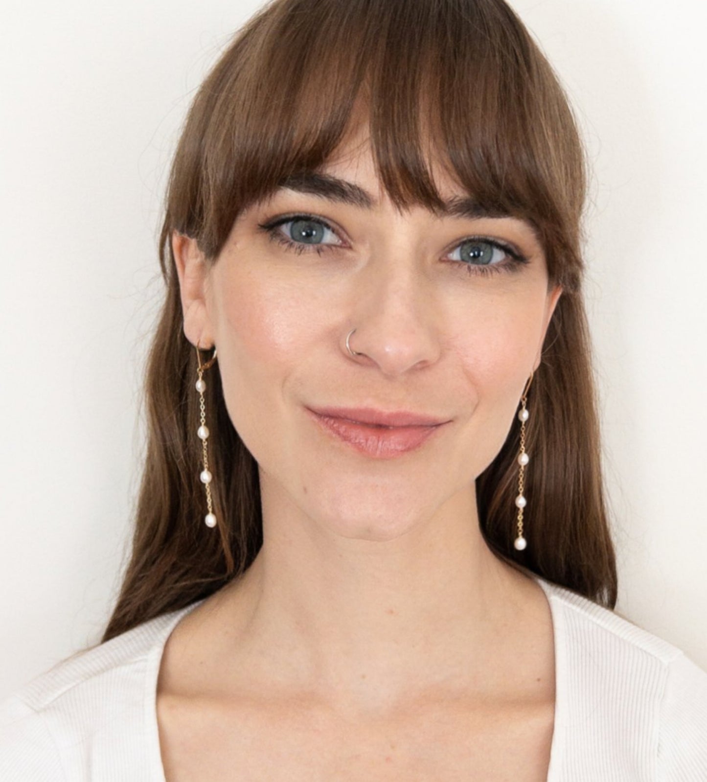 model wearing Rosa Collection Long pearl earrings drop
