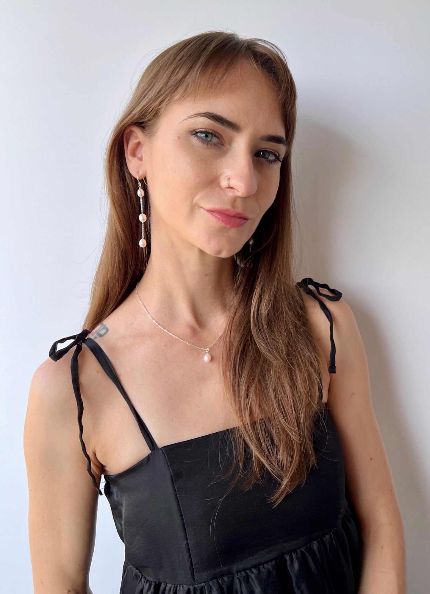 Nicola necklace and earrings on model
