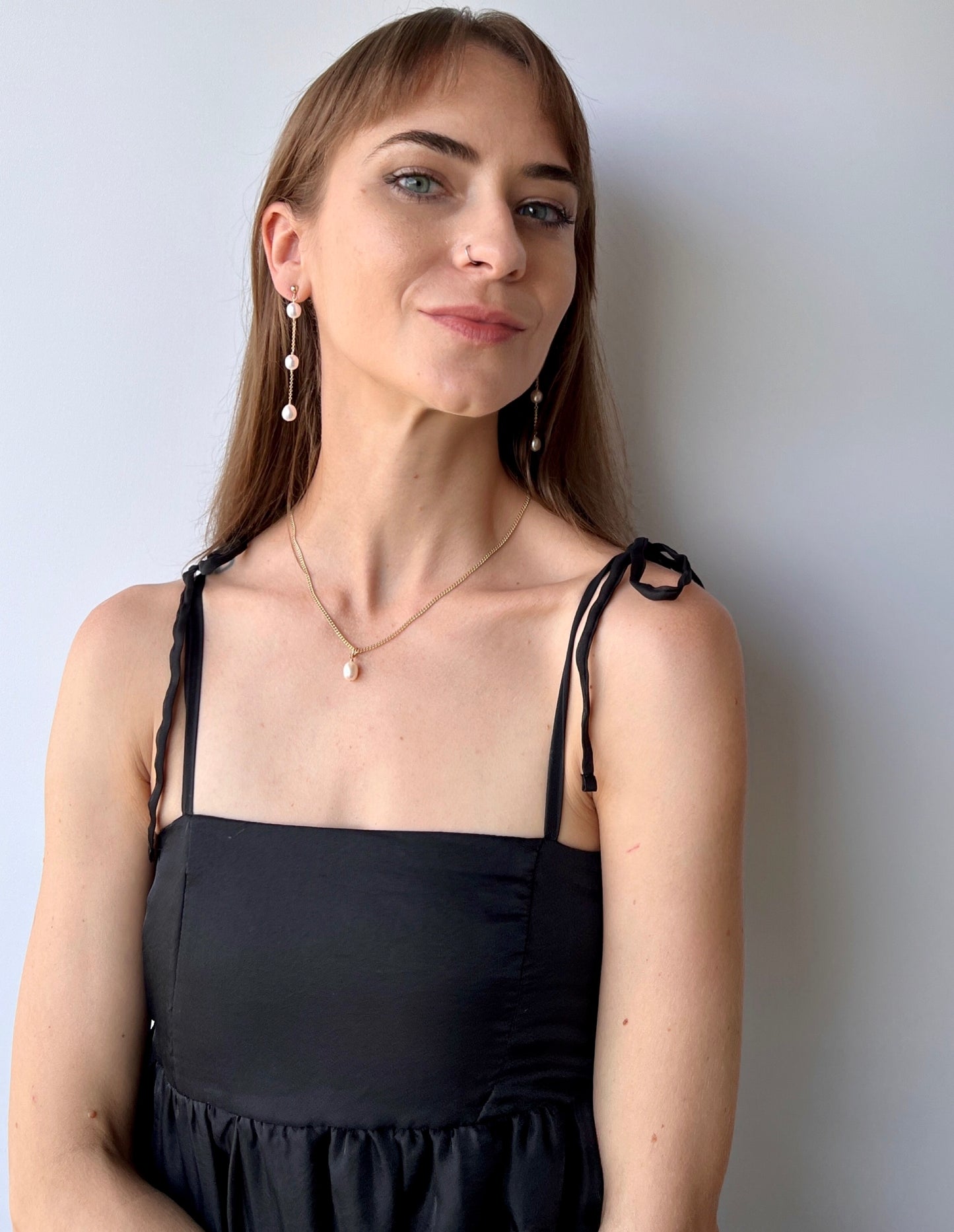 3 pearl earrings on model