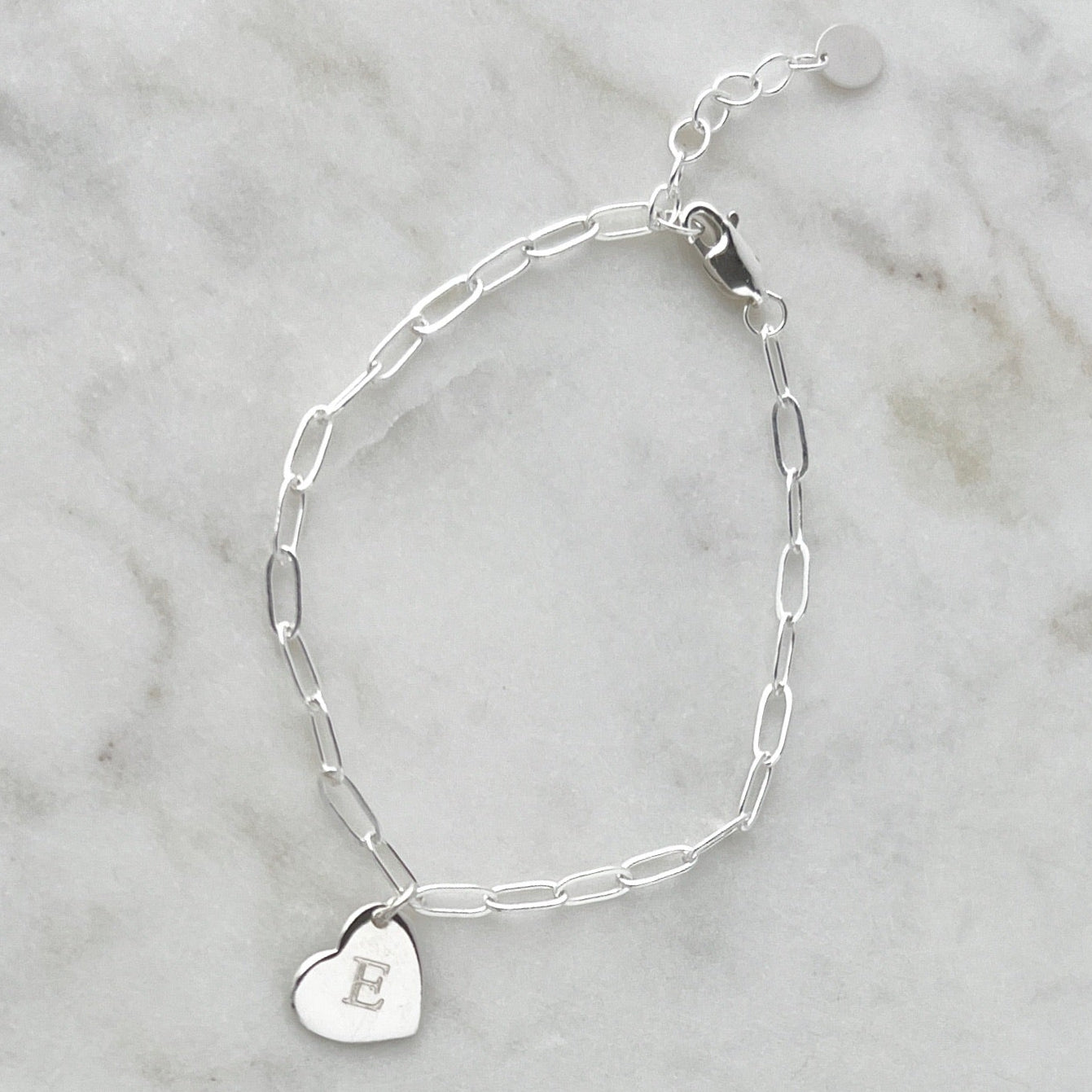 Sterling Silver bracelet with a heart-shaped charm engraved with a single letter