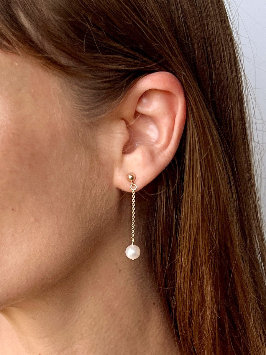 14k gold filled pearl stud earring on model. Lucia wedding pearl earrings