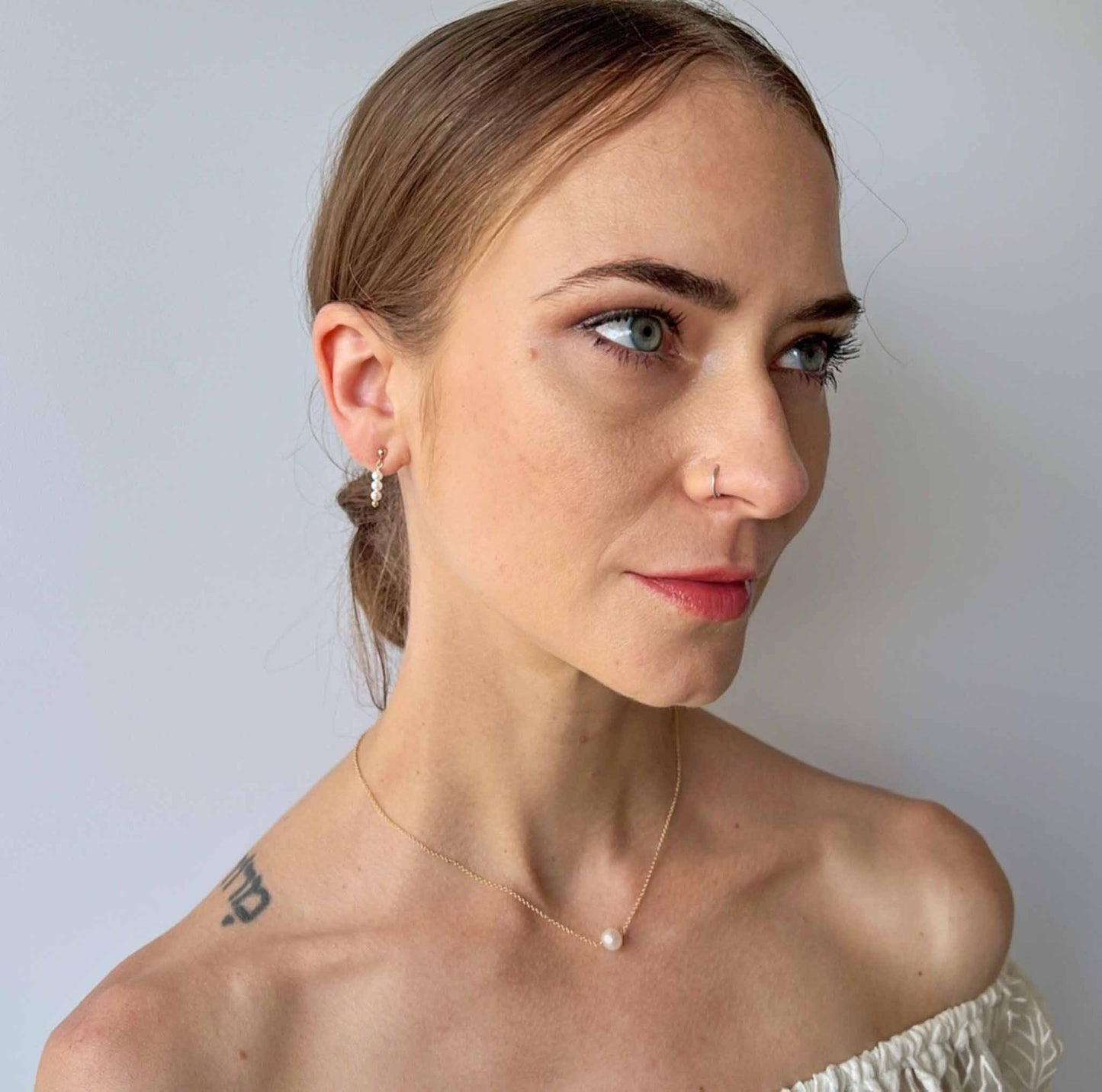 model wearing Lucia Single Pearl Necklace and earrings from Gigi Collection