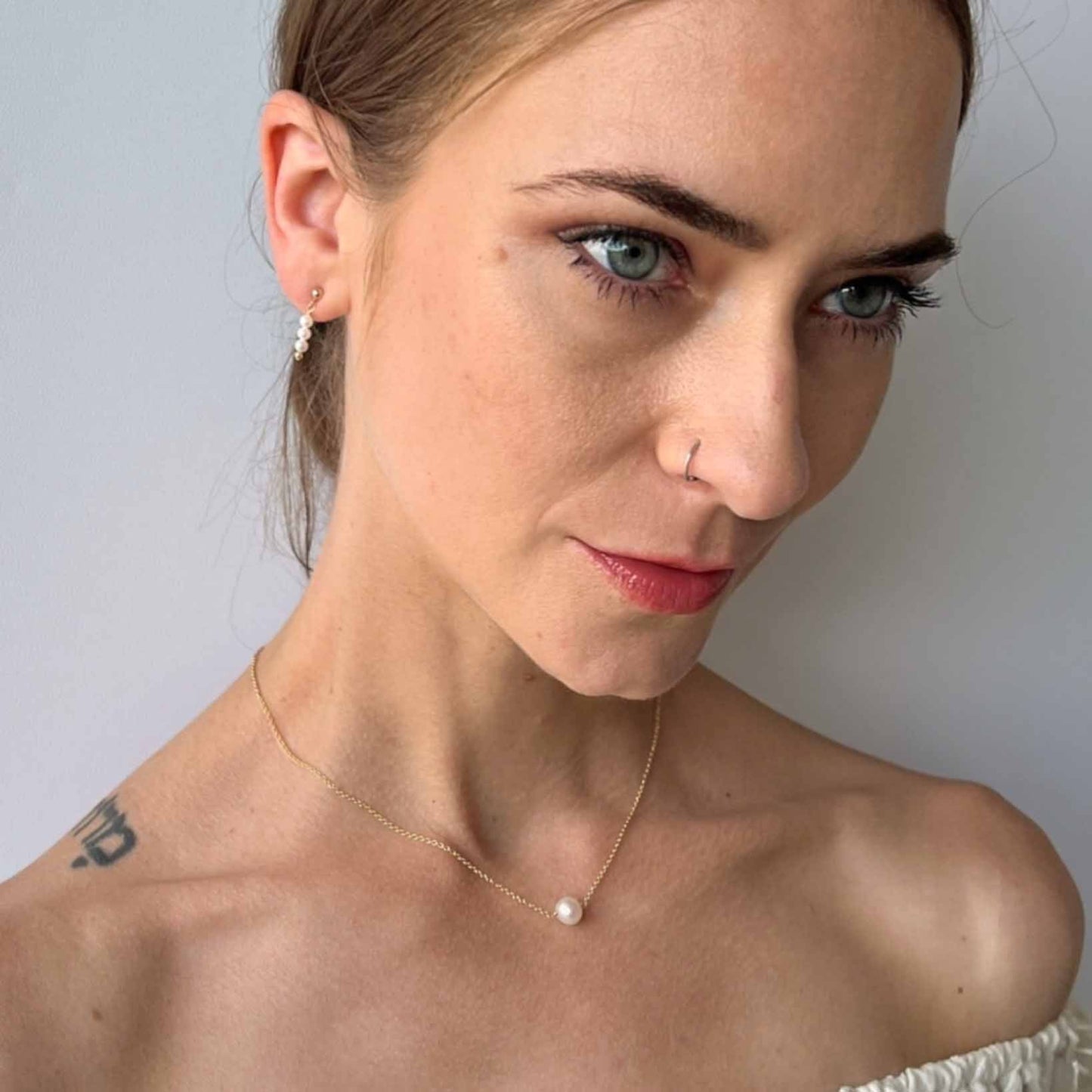 Lucia Single Pearl Necklace on Model on 14k gold filled chain