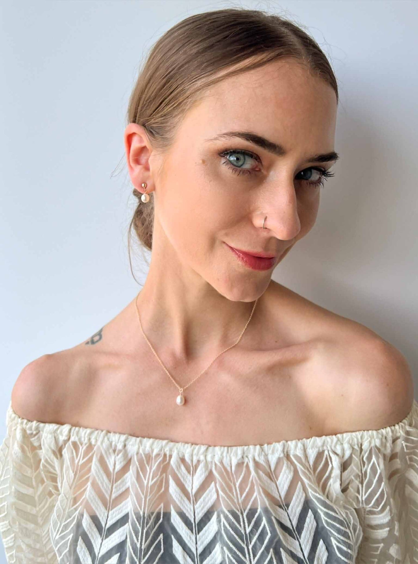 model wearing necklace and earrings set from the Nicola collection