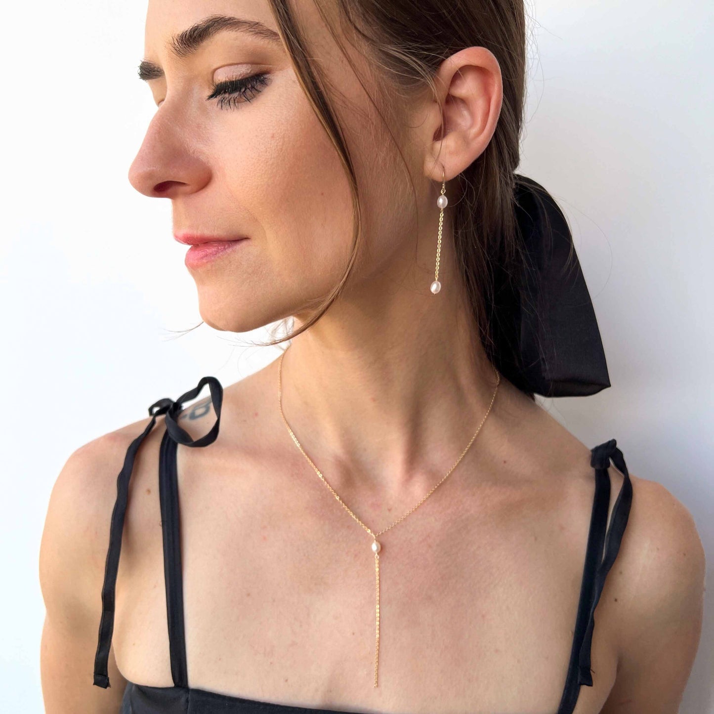 Model wearing Necklace and Earrings Set of Rosa Pearl Jewelry