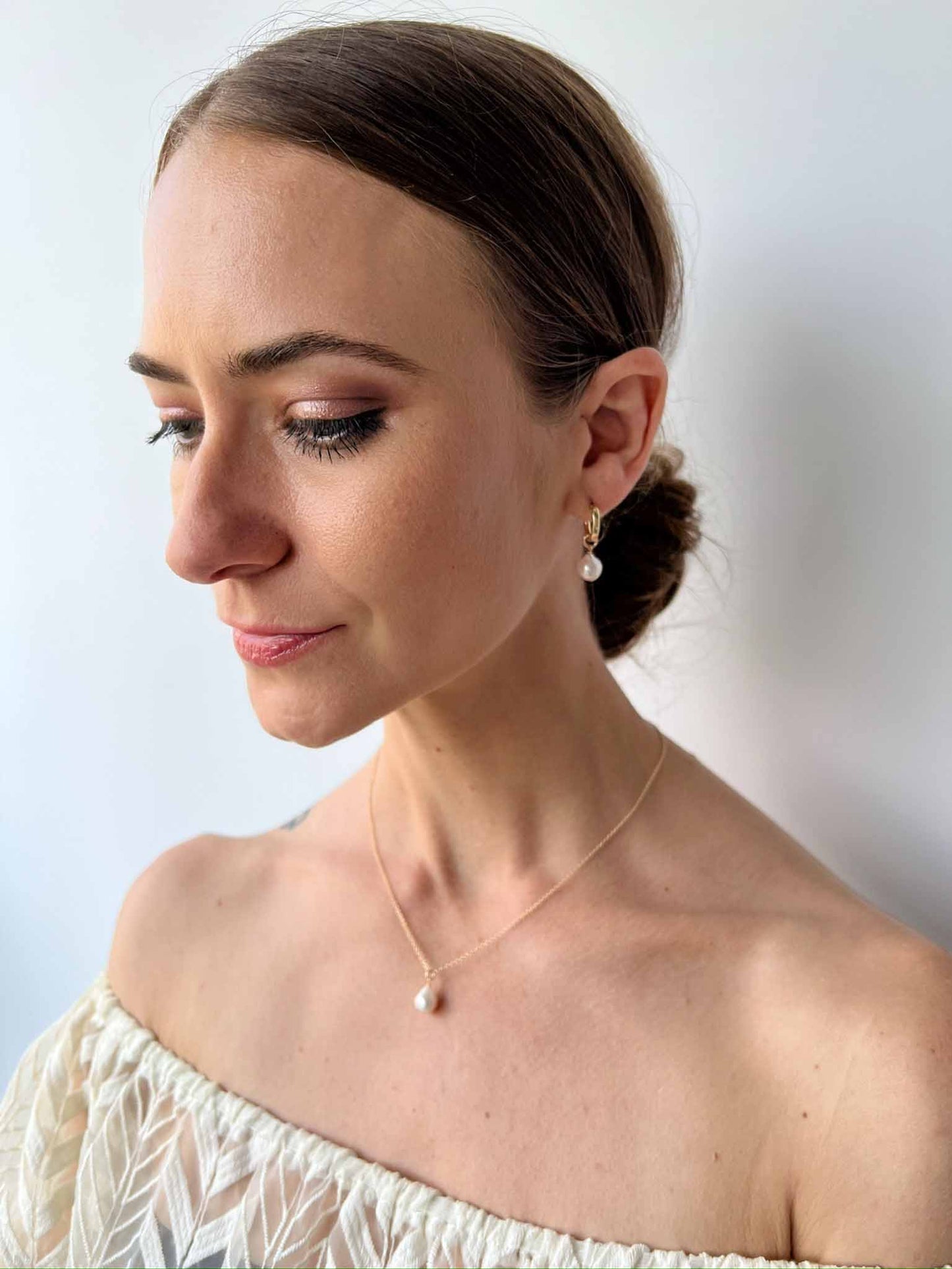 model wearing matching necklace and earrings from the Vivara Collection