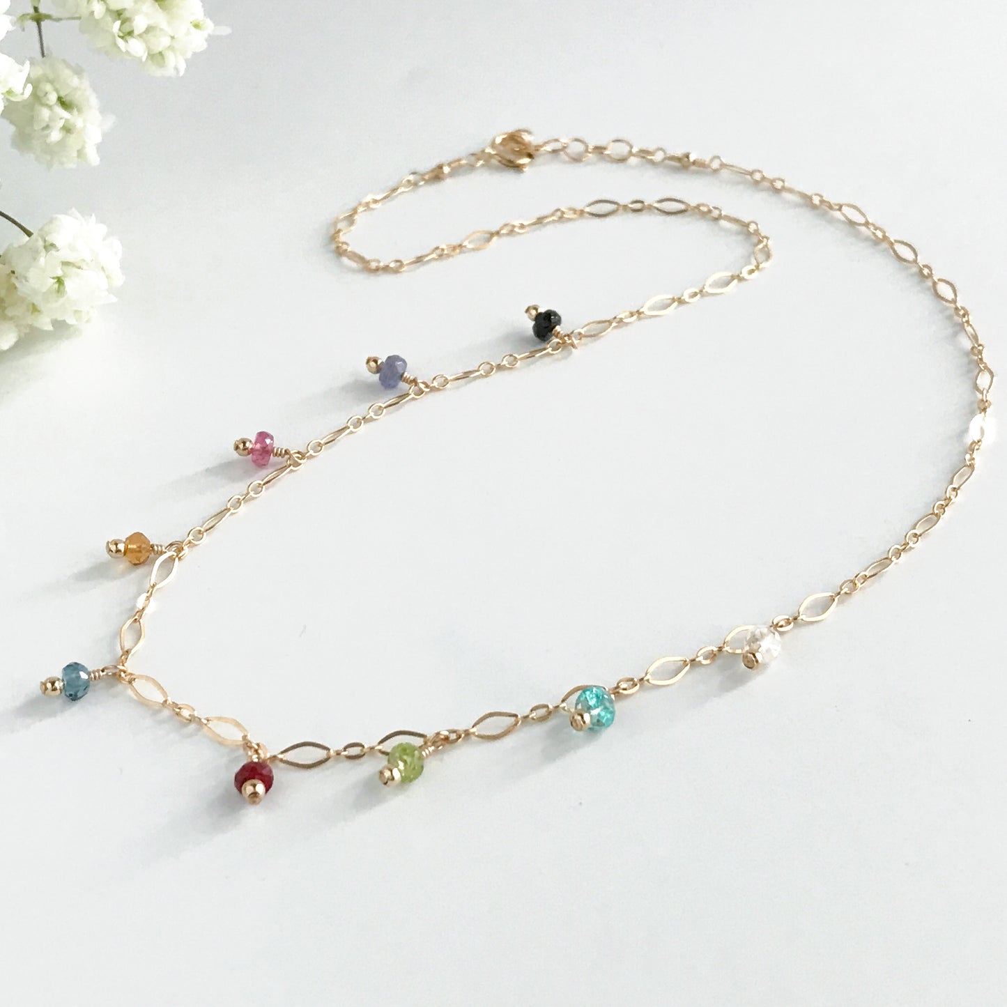 close up of dangling gemstone necklace availabe in 14k gold filled and sterling silver