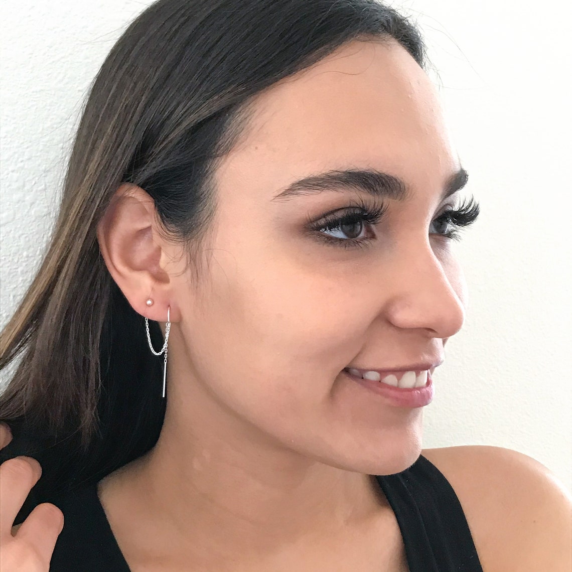 two hole earrings shown on model