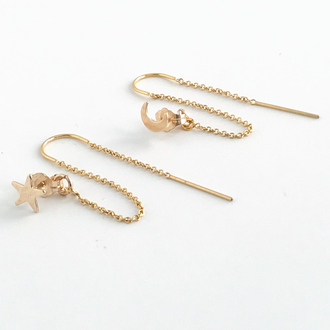 pari of star and moon double piercing earrings in 14k gold filled