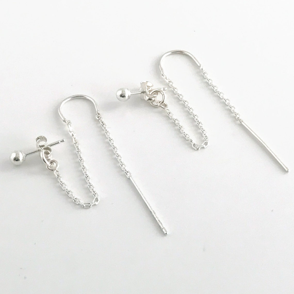 product close up of sterling silver double hole earrings designed for two ear lobe piercings
