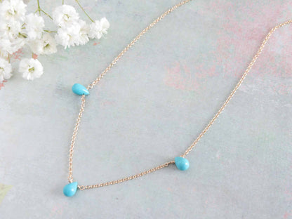 close up of turquoise station necklace for women available in sterling silver or 14k gold filled