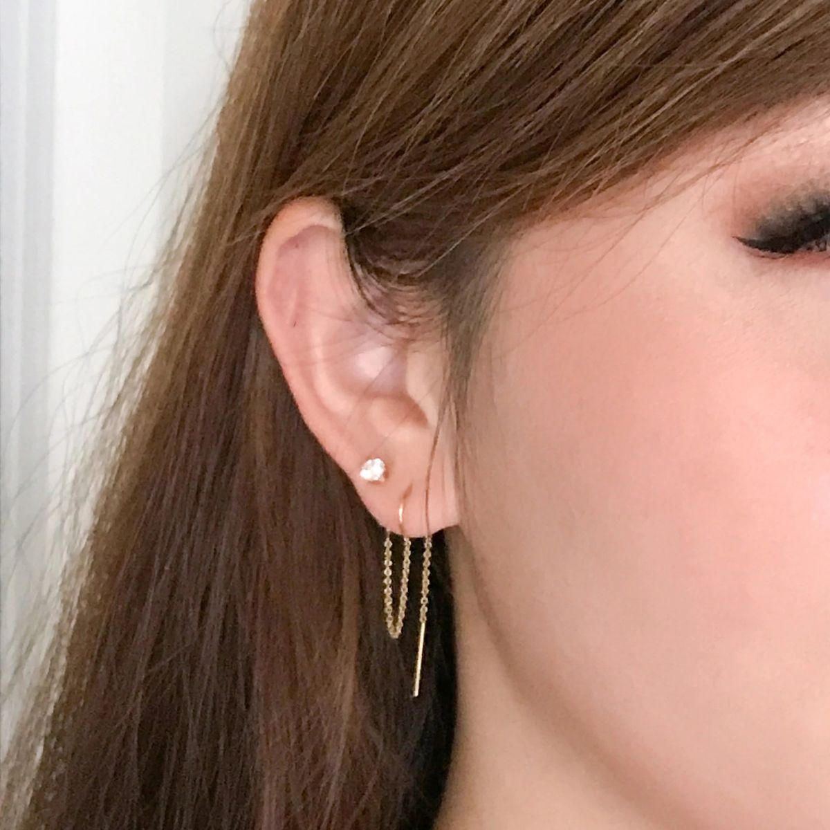4mm cubic zirconia double lobe piercing earrings shown on model