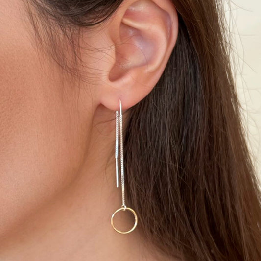 Mixed metal gold and silver long dangle earrings.  Model is wearing long silver threader earrings with 14k gold filled ring in front