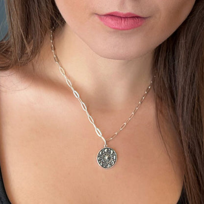 model wearing moon phases pendsnt