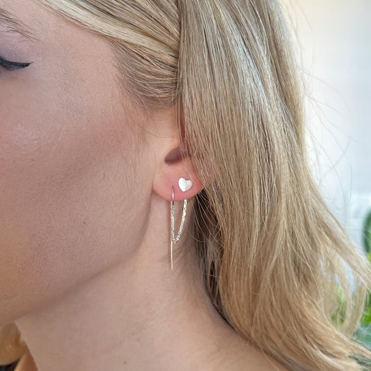 double piercing earrings with a heart stud
