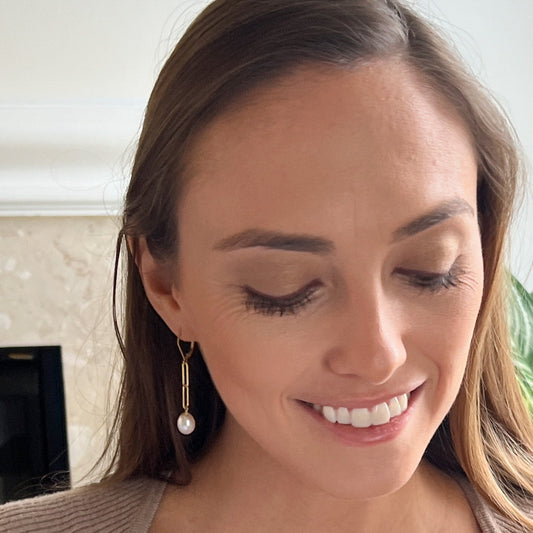 model wearing leverback pearl earrings