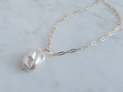 close up of baroque pearl pendant
