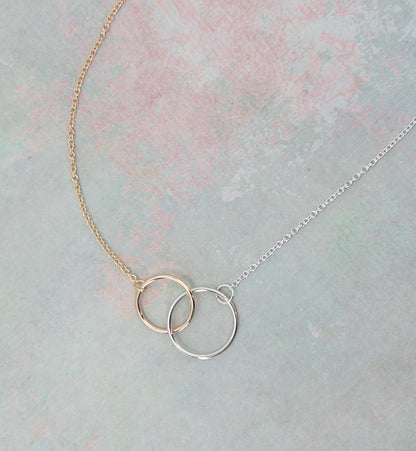 close up of gold ring and silver ring connected