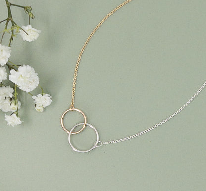 connected rings necklace in gold and silver