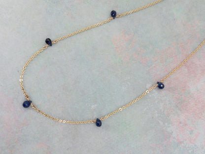 close up of tiny sapphire necklace