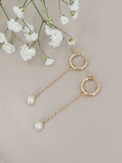 pair of 14k gold filled huggie hoop earrings with pearl dangles