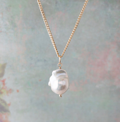 close up of big pearl pendant