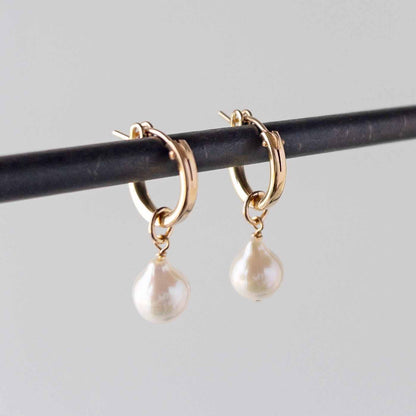 pearl hoop earrings  on stand