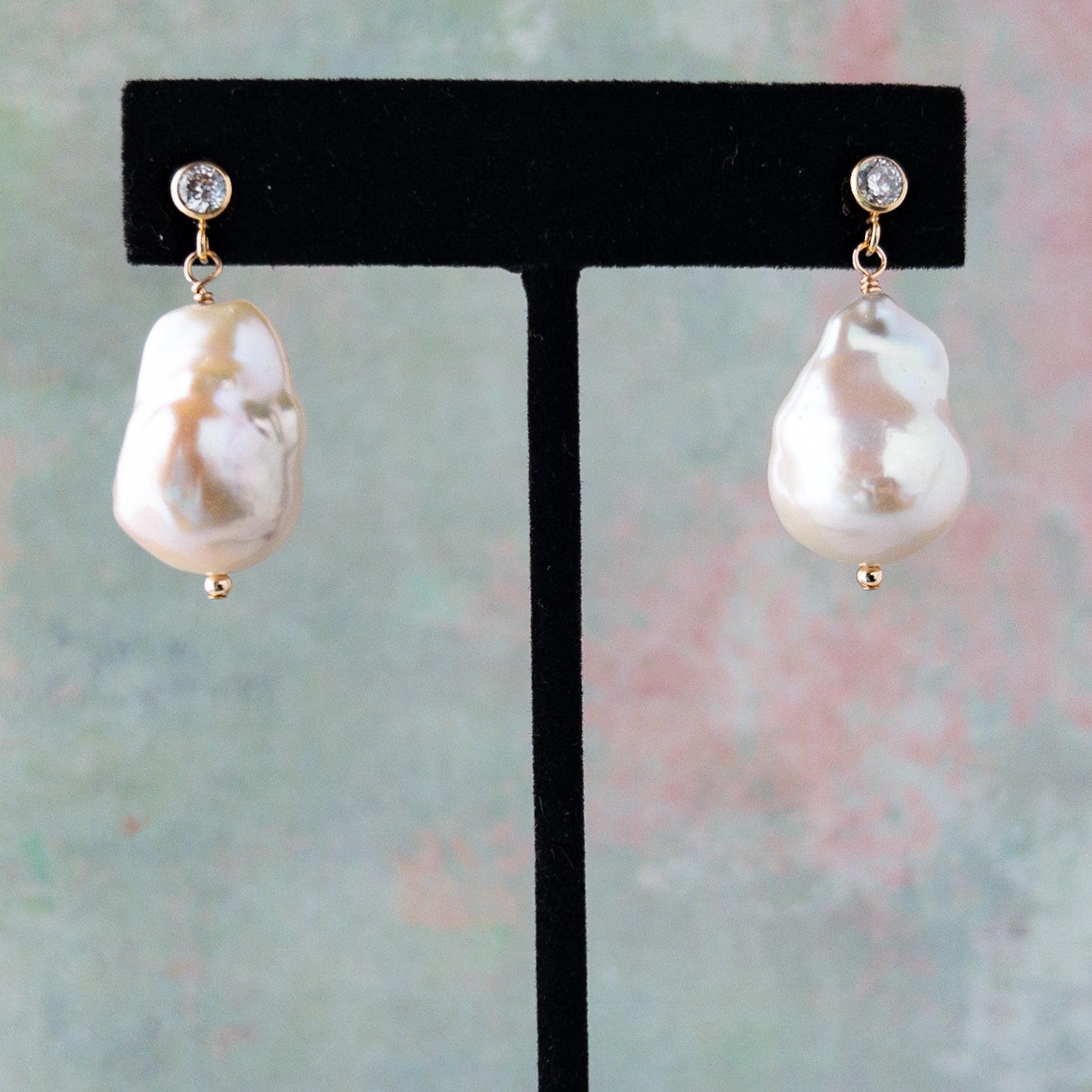 baroque pearl stud earrings on earring stand