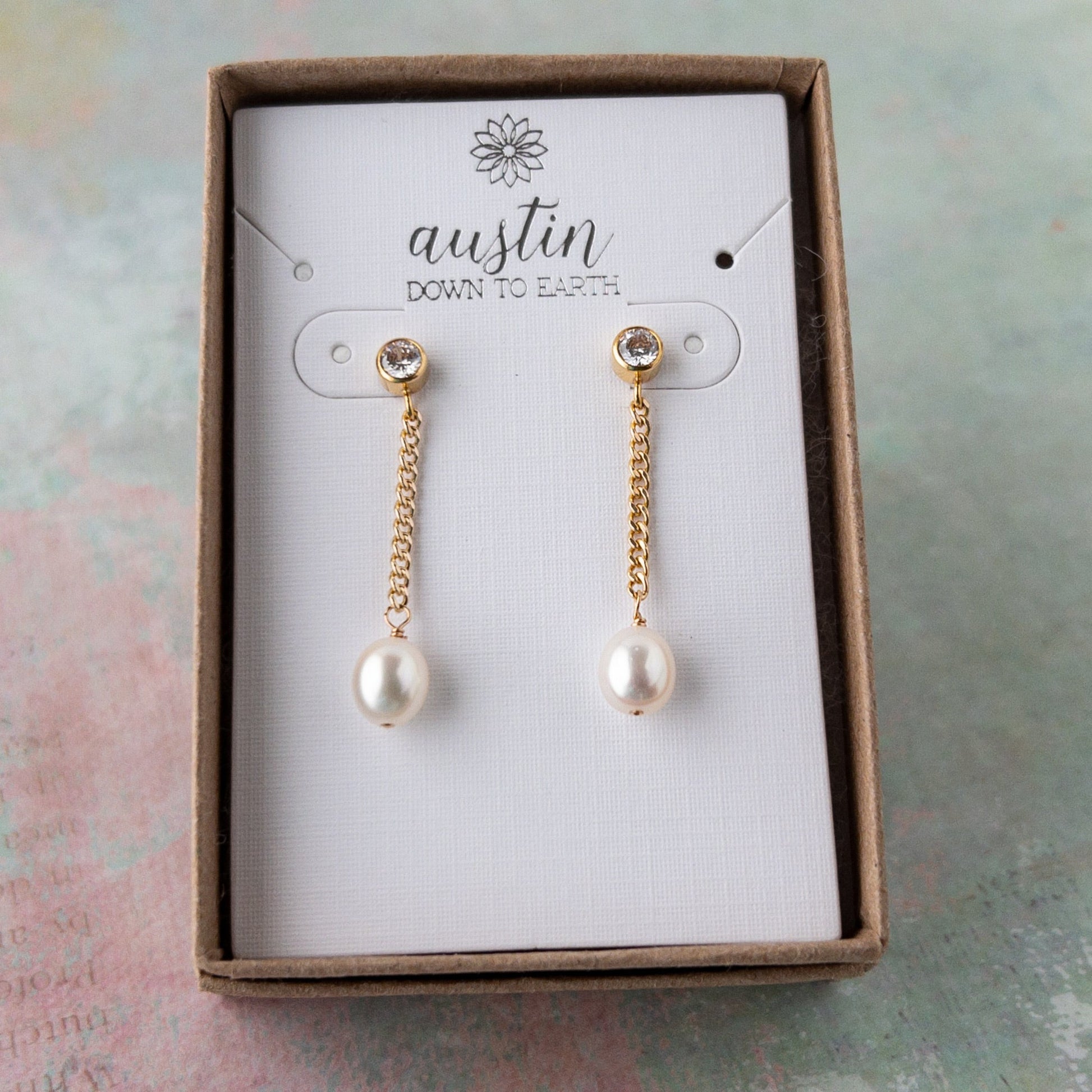 Pearl Dangle Earrings featuring a cubic zirconia stud, curb chain and freshwater pearls shown in gift box