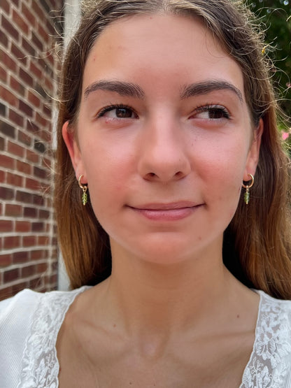 model with peridot earrings 