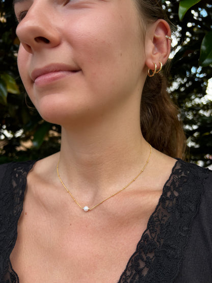 model close up showing 1 pearl necklace on satellite chain in 14k gold filled