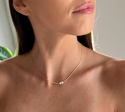 model wearing 16 inch two pearl version of Lucia Add A Pearl Necklace