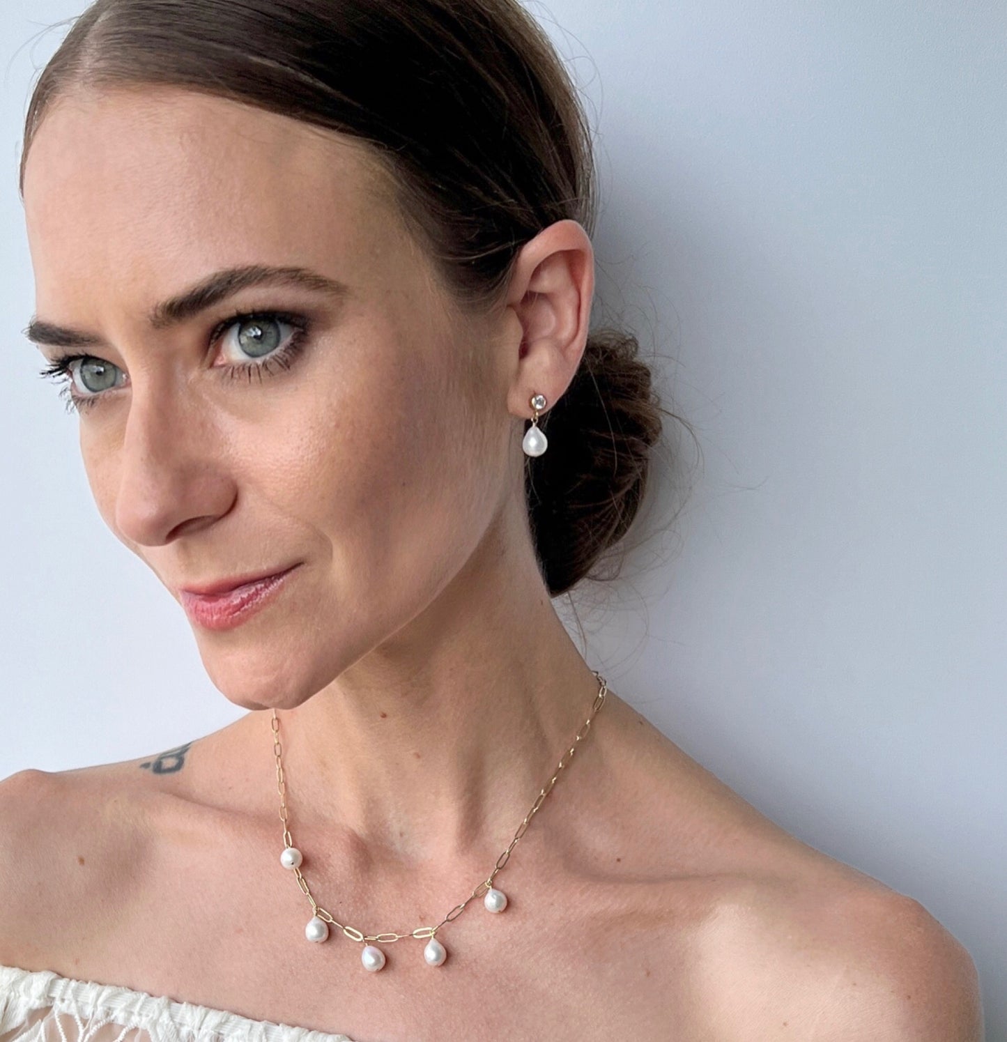matching necklace and earrings set on model from the Vivara collection