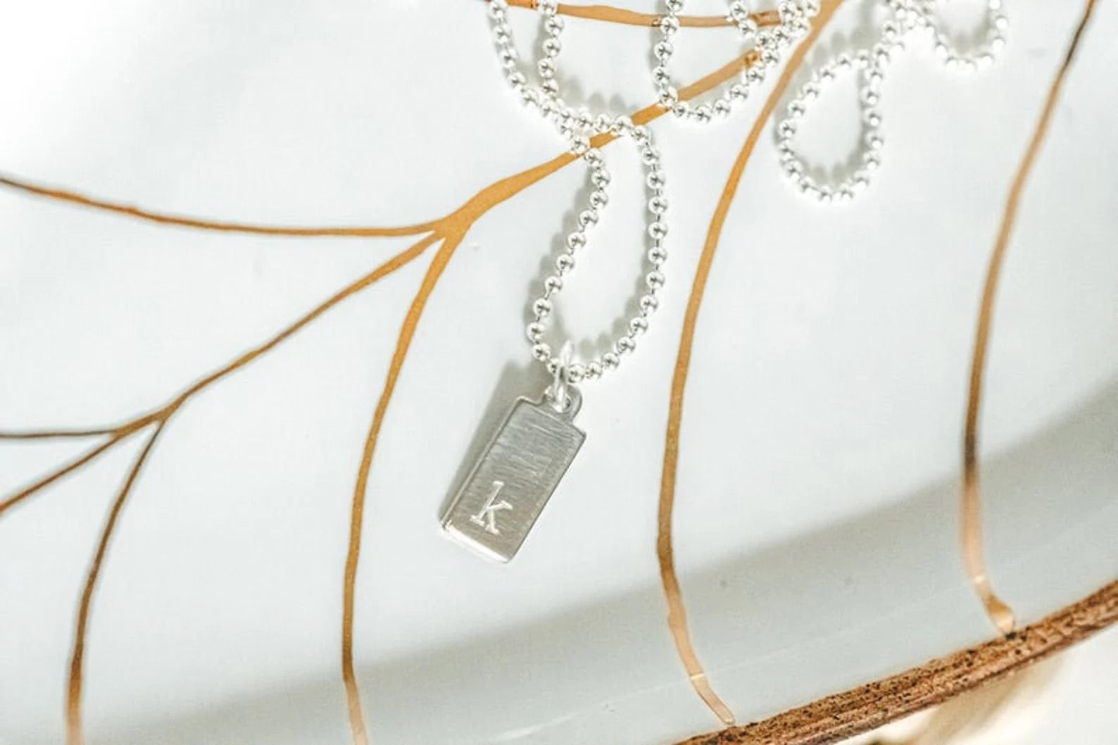 close up of engraved tag in sterling silver