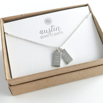 dog tag necklace in sterling silver with two engraved charms