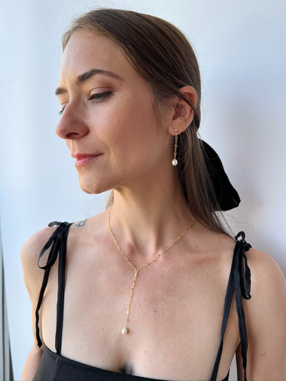 model wearing necklace and earrings from Isabella collection Lariat Necklace with matching pearl earrings