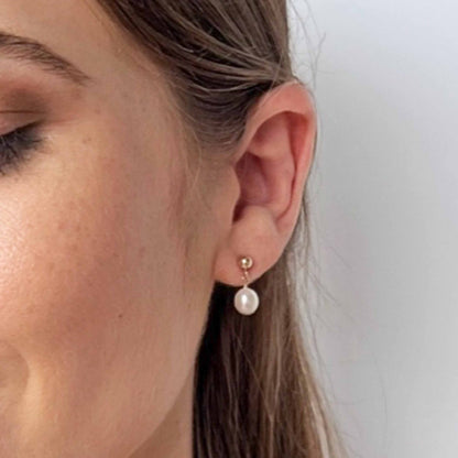 model close up of Nicole pearl drop earrings