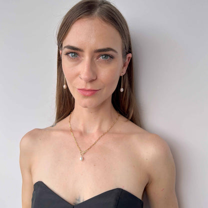 model wearing Nicola paperclip pearl necklace and matching Nicola earrings