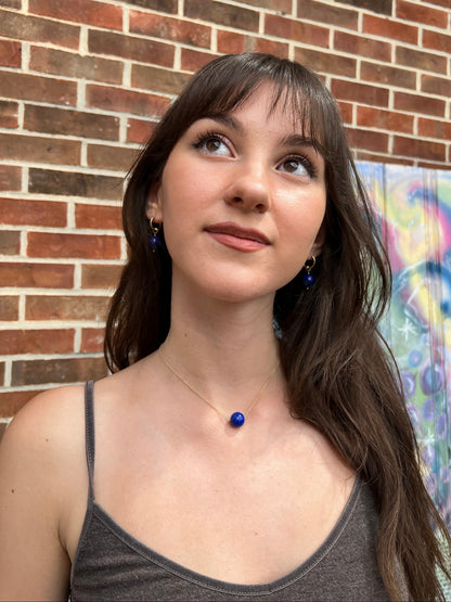 woman wearing large 10mm lapis ball floating necklace